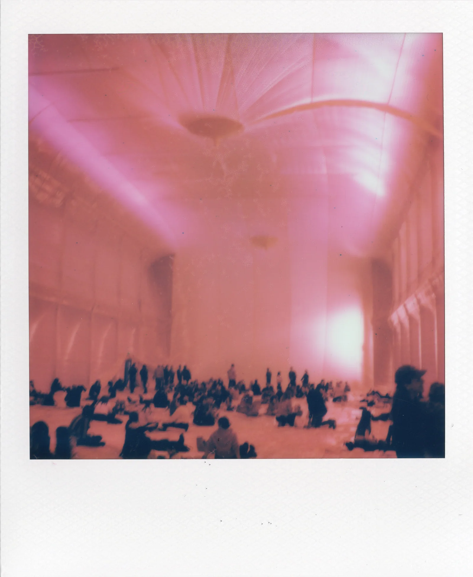 Pink Polaroid artwork showing a vaulted interior or hall.