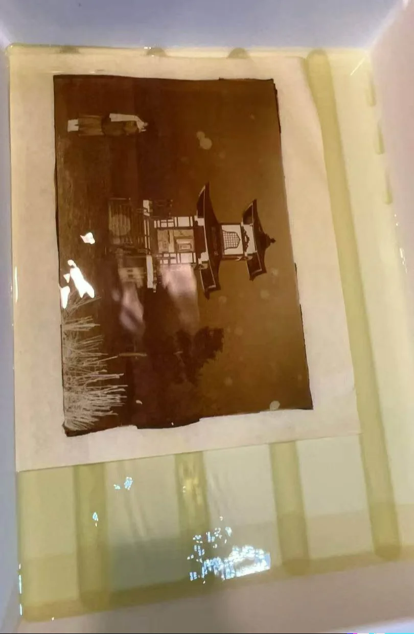 Warm-toned process study on translucent material with visible reflections.