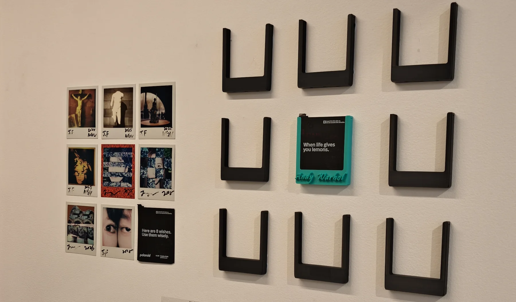Gallery wall documentation showing the Eight Wishes grid and the draw-card installation supports.
